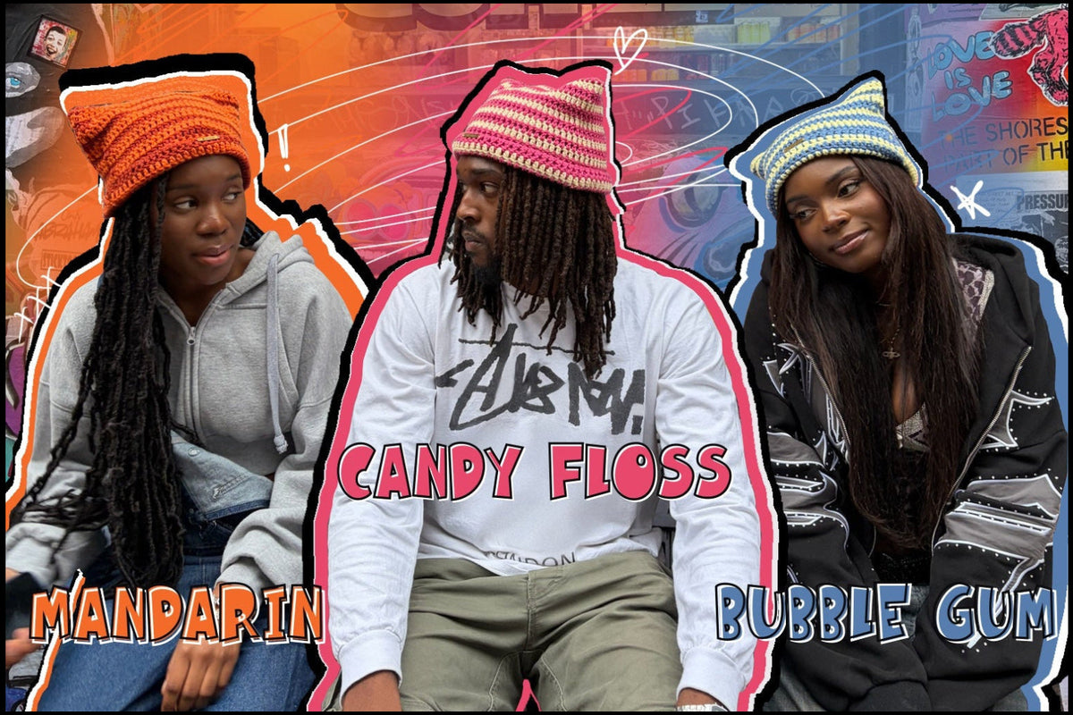 graphic for 'DAMZ DESIGNZ THE EAR CANDY COLLECTION' featuring three models wearing colorful beanie hats and styled with labels 'MANDARIN', 'CANDY FLOSS', and 'BUBBLE GUM' against a graffiti-covered storefront background.